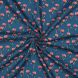 Cotton Poplin Fabric with red flower print on blue background