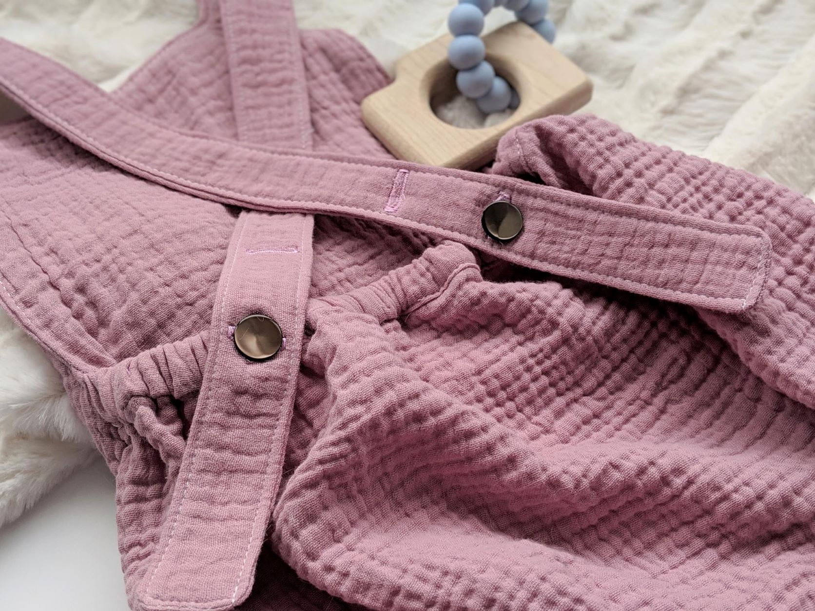 Baby romper in rose gauze
